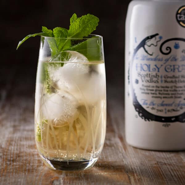 Holy Grass Vodka Perfect Serve in a large glass garnished with mint leaves