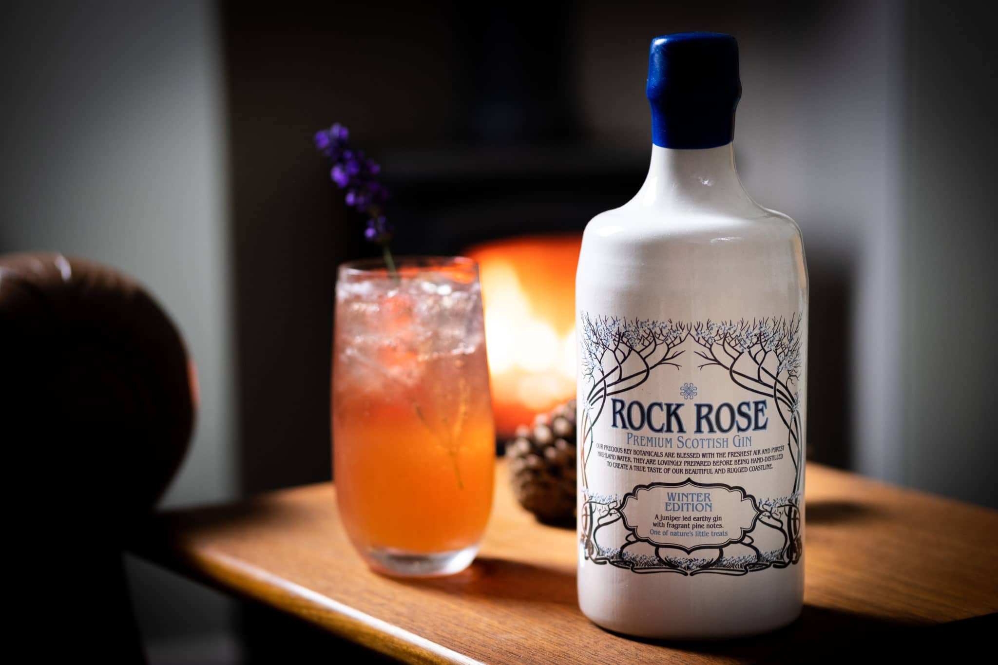 Bottle of Rock Rose Gin and Force My Hand Cocktail served in a tall glass