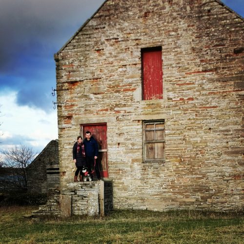 Claire & Martin from Dunnet Bay Distillers in front of the Castletown Mill building office door