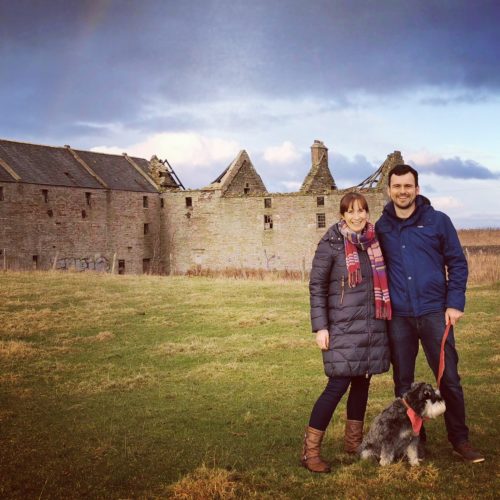 Castletown Mill building with Claire & Martin from Dunnet Bay Distillers in the forefront with Mr Mackintosh the dog