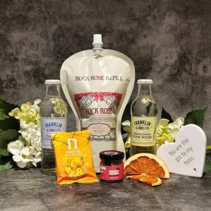 Content of the Refill Rewards Club box for February 2021 including Rock Rose Gin pouch tonic waters, spicy oatcakes and small jar of nut butter