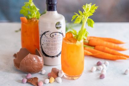 Bottle of Holy Grass Voska, Chocolate easter egg and Bunny Mary Easter cocktail served in a tall glass