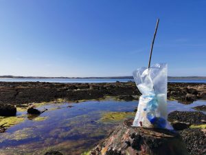 Plastic bag full of rubbish picked up on the beach