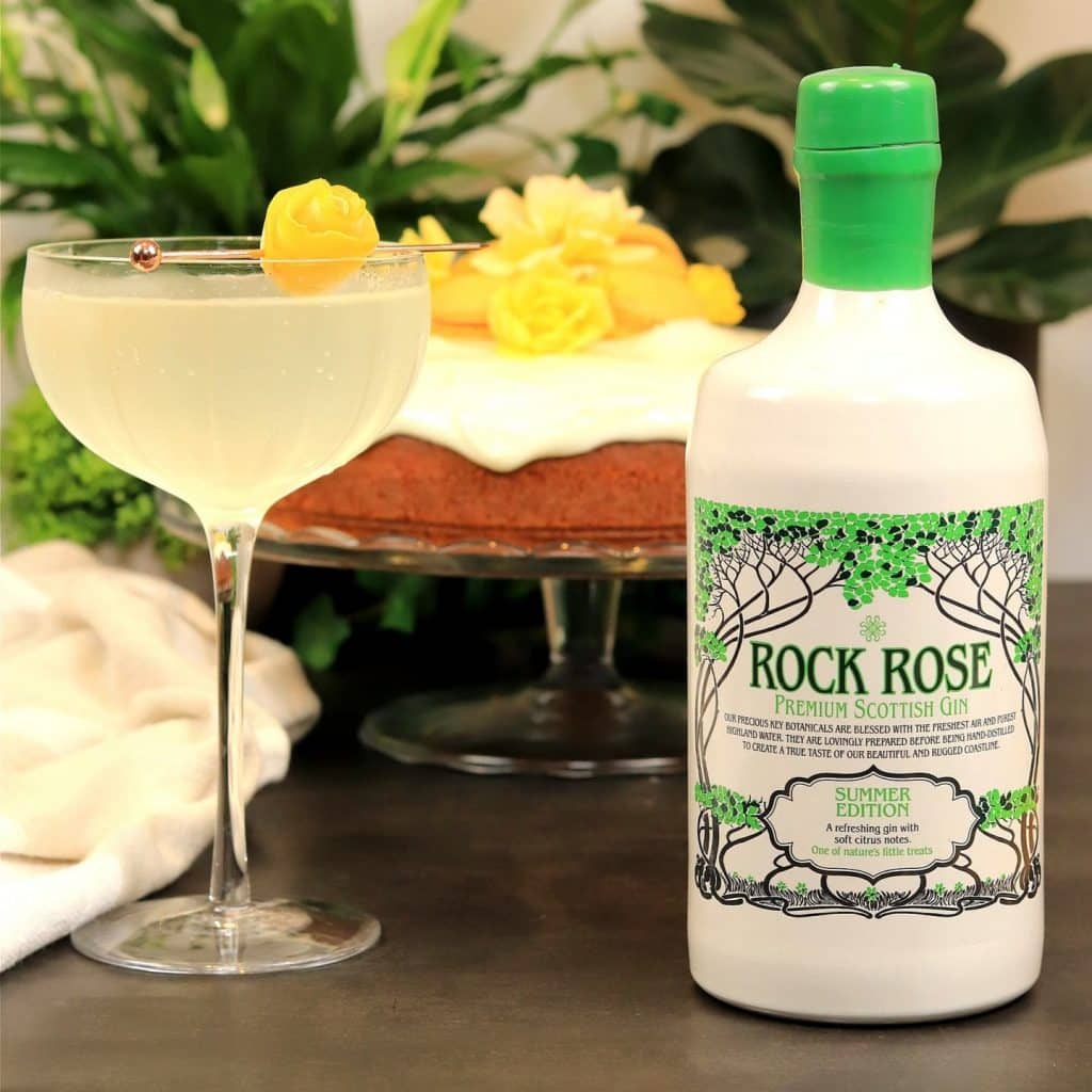 Bottle of Rock Rose Gin Summer Edition and Citrus Celebration cocktail service in a coupe glass