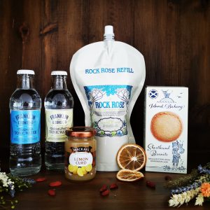 Content of the Refill Refill Rewards Club box for September 2021 including Rock Rose Gin pouch, ginger ale, lemonade, shortbread biscuits and lemon curd jar