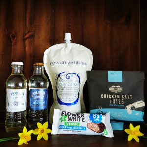 Content of the Refill Rewards Club box for March 2022 including Holy Grass Vodka pouch, tonic waters, chicken salt fries and vegan chocolate bar