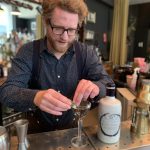 Picture of Kit Stutt owner of The Clockwork Rose bar preparing a cocktail with Holy Grass Vodka