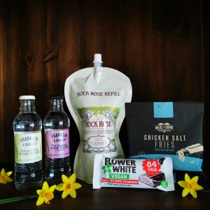 Content of the Refill Rewards Club box for March 2022 including Rock Rose Gin pouch, tonic waters, chicken salt fries and vegan chocolate bar