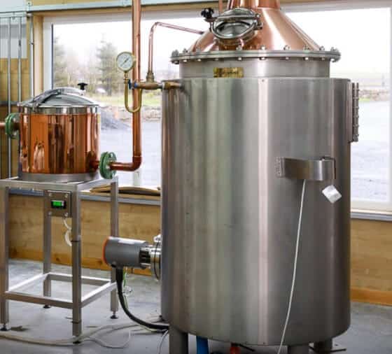 Picture of a copper still in the distillery still house